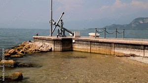 Anchor at the lake promenade of Bardolino at Lake Garda (Lago Di Garda) in Italy.