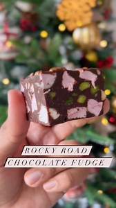 Who doesn’t like some extra cheer or should I say an extra block of sweetness to make this holiday season merrier? These thick, decadent and perfect rocky road fudge squares are here to do that. The texture is so unusual with the crunch and the stickiness but somehow it all goes perfectly and melts in your mouth just like that🥰 Ingredients 2 cups (350g) chopped dark chocolate 1 can (400g) sweetened condense milk 2 tablespoon (30g) melted butter ¼ cup (31g) pistachios ¼ cup (35g) almonds ½ cup (