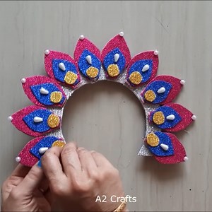 2.6K views · 59 reactions | Crown / Kiritam/Prabhavali for Devi/Lakshmi Puja| Pooja decoration ideas Materials: Cardboard sheet Craft stick hot glue(Fevi Quick) Foam Sheet Pearls | A2 Crafts | Facebook