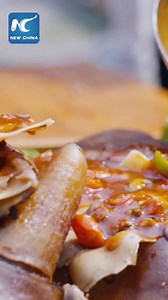 A must-visit carnival for foodies! Serving over 1,000 kinds of mouth-watering snacks and dishes from China and Southeast Asian countries, a joyous gastronomical event is now underway in Weishan County of southwest China's Yunnan Province. | Cultural Buffet