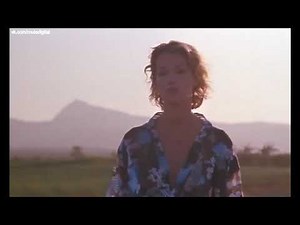 Brigitte Lahaie braless in a sheer blue blouse—"joy et joan" (1985)