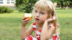 Little Girl Eating Apple Walk Stock Footage Video (100% Royalty-free) 1291690 | Shutterstock