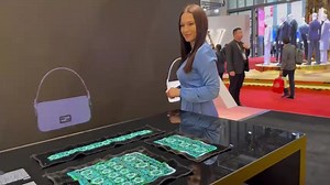 Arina is in the hall dedicated to #fashion and #art at the 6th #CIIE. At LVMH pavilion, there is a very special bag inspired by embroidery patterns of the Chinese minority Yi. Follow Arina to check it out! | Shanghai Daily 上海日报 | Facebook