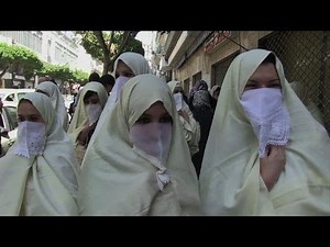 Women in white march to defend Algeria tradition