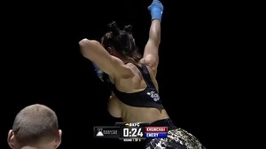 Female boxer celebrates her victory by flashing the audience her magnificent tatas