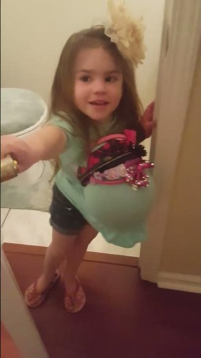 Toddler pretending to go to the hospital to have a baby