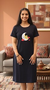 New Arrivals 💓 Drift off to dreamland in our ultra-comfortable Navy Blue Cotton Short Nighty. This nightdress is designed for a peaceful night's sleep, combining a classic silhouette with a whimsical and charming graphic. Crafted from soft, breathable cotton, this nighty is perfect for keeping cool and cozy throughout the night. The rich navy blue color provides a stylish backdrop for the adorable sleeping crescent moon and star graphic, which is accented with cute red clouds. Its relaxed fit,