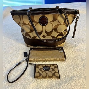 Coach signature striped tote with matching tech wallet and change purse.