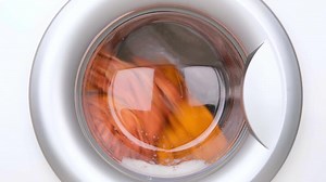 washing orange clothes in the washing machine