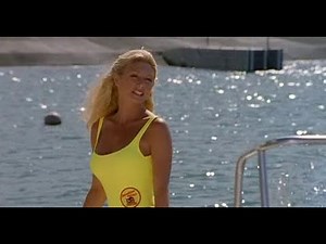 Baywatch's Brande Roderick lays herself bare as she unbuttons top to show curves