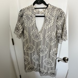 Ivory/ Black flower pattern dress. Chic but sexy with keyhole cutout.