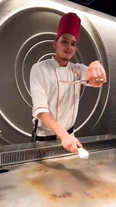 Get ready to be amazed by our incredible chef! Watch as he showcases his extraordinary spatula skills. #cheftrick | Benihana