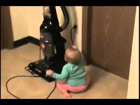 Kid Plays with Vacuum Cleaner