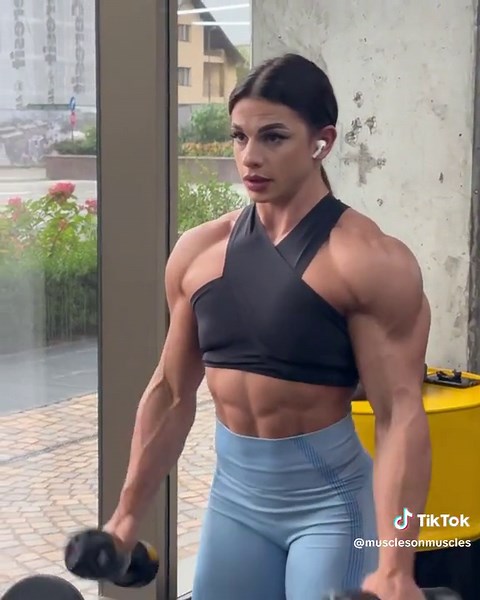 Female Bodybuilders Flexing Muscles and Showing Strength