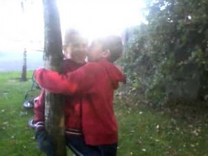 Two 7 year olds kissing