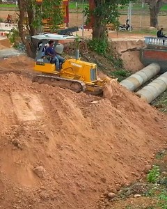 13 reactions | Spectacular!!! Filling Drainage Cement Pipes: Mini Bulldozer Komatsu D20A Pushing Sand With Dump Truck Operated to Send Sand | Bulldozer Operator | Facebook