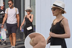 Kylie Minogue pictured with a ring on her engagement finger again on day out with boyfriend Paul Solomons