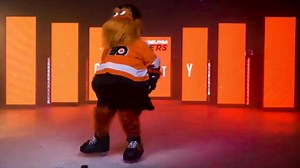 Maskottchen Gritty tanzt
