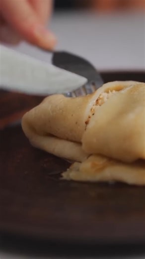 Mountain woman cooking tasty homemade sweet pancake. | Country Food