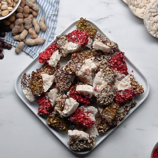 171K views · 746 reactions | Turn rice cakes and your favorite nuts and freeze-dried fruit into a sweet treat with a dip in melted chocolate and a sprinkle of flaky salt! Recipe: https://tasty.co/recipe/chocolate-dipped-rice-cake-candy-bar-bites | Tasty | Facebook