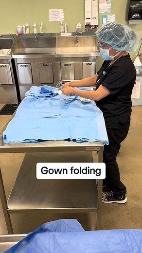 In school, surgical technology students practice folding gowns so that they can master the proper gowning and gloving technique. | Community Care College