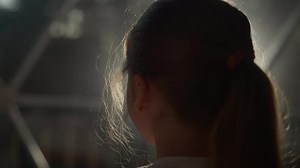 Child Silhouette in Dark Room at Backlight