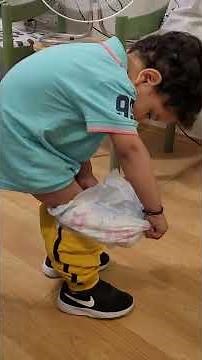 baby removing his diaper alone