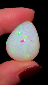 ‘Snake skin’ Opal Egg 🌈🥚This Ethiopian Opal displays a vibrant play of color that shines from every viewing angle. It features a beautiful 'snake skin' pattern that concentrates flashes of color into a mesmerizing display. Opal is composed of microscopic silica spheres that interfere and diffract light, creating stunning flashes of color. Typically, Ethiopian Opals are cut into cabochon shapes, and finding one in an egg shape makes this piece extra special.This one is available, please message