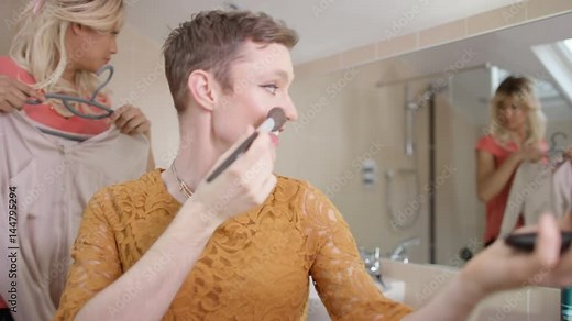 2 Transvestite men getting dressed as women & putting on make-up