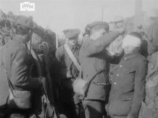 An RAMC captain tends to wounded in a forward trench in 51st (Highland) Division's sector between Roclincourt and Neuville Saint Vaast, 15 May 1916. Film: IWM 133 | Imperial War Museum London