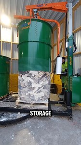 This automated firewood packing machine lifts a full steel cage while wrapping it tightly with durable mesh. | Gayle’s Smart Ideas