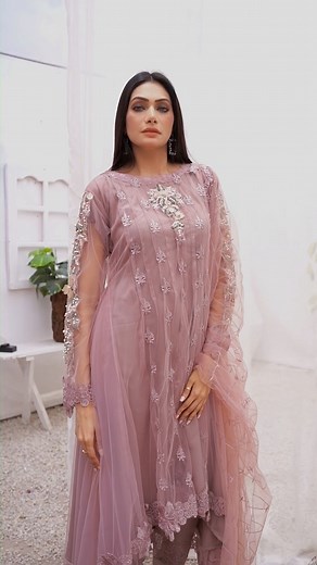 This Lilac Embroidered party wear dress is an ideal blend of elegance...