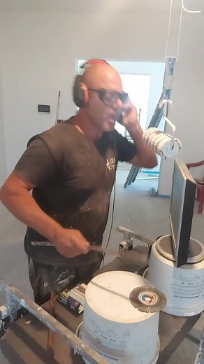 Construction Worker Handling Flexible Tubing Techniques