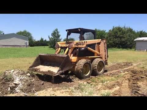 Mustang 940 skid loader doing dirt work in Quinlan, Texas