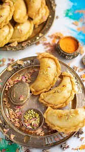 24K views · 33 reactions | This delicious Mawa Gujiya is an authentic Indian sweet fried dumpling, filled with a mixture of mawa (milk solids), nuts, and coconut. Comment “gujiya” to get the recipe #gujiya #mawagujiya #indianfestival #indiansweets #indiansessert #mithai #reelitfeelit #reelkarofeelkaro #reelrecipe #recipevideos #diwali2024 #diwali #diwalirecipes | Piping Pot Curry | Facebook