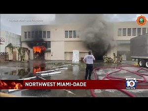 Miami-Dade firefighters continue to battle warehouse fire