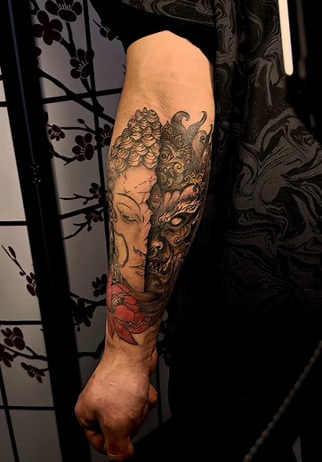 Balance of Light & Dark ⚖️🔥 This half Buddha, half Yama tattoo symbolizes the duality of life—peace and chaos, serenity and strength. Inked with precision, crafted with passion! ✨💀 DM for bookings! Let’s create something legendary! 🎨 #TattooArt #BlackAndGreyTattoo #BuddhaTattoo #OniTattoo #ForearmTattoo #CustomInk #TattooIdeas #TattooLover #TattooLife #InkAddict #Tattooed #TattooInspiration #BodyArt #TattooCulture #TattooArtist #TattooStudio #TattooWork #TattooPassion #TattooDesign #TattooWor