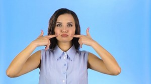 Young Woman Puffed Out Her Cheeks Stock Footage Video (100% Royalty-free) 1037652548 | Shutterstock