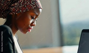 Senegalese Woman Completing Job Application Online