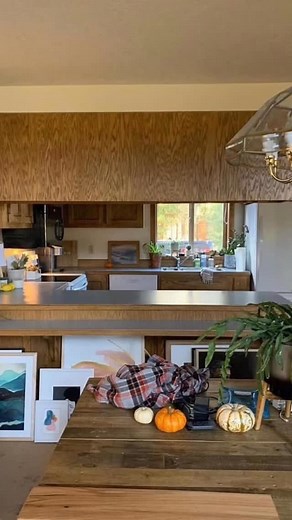 Transformation Tuesday ✨ Nothing like a 1950s kitchen glow-up to kick off the week! The “before” was dark, closed-off, and begging for fresh air. That giant upper cabinet wall? It swallowed every bit of natural light. But LOOK at her now! 😍 ✨ Wall of windows = instant sunshine ✨ Re-oriented the whole workspace for flow ✨ Warm woods deep green cabinetry ✨ Modern lighting to brighten day night ✨ Open shelves clean lines for breathing room Proof that you don’t need to add square footage — sometime