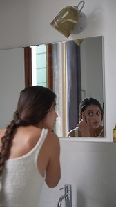 Woman Washing Face in Bathroom | Premium Stock Video Footage