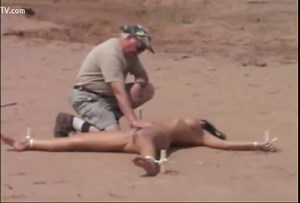 Woman cries after she is stripped, bound and dies in desert heat