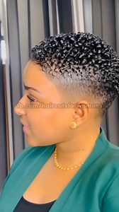 A sleek, wet-look curly fade with clean edges and a low, polished taper. The green blazer and gold jewelry add elegance, giving the style a refined yet modern vibe. ✨ #curlyhair #fadehaircut | Haircuts for Women