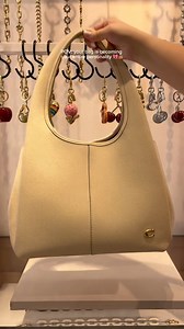What is your favorite Coach charm? 🍓🍒🌸 #tulsa #oklahoma #coach #woodlandhillsmall #mall #mallhaul | Woodland Hills Mall