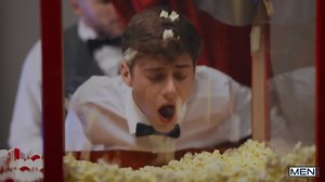 buttering his popcorn