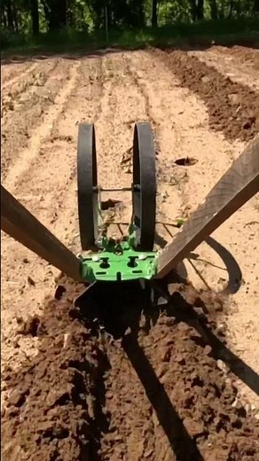 Plowing the garden with the #hosstools Hoss Tools double wheel hoe. #gardentools #wheelhoe