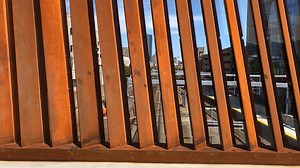 From one side to the other. Students cross campus on the pedestrian bridge. | Northeastern University