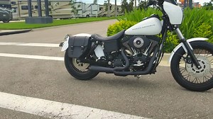 Check out this bad ass project! Tech Brian Hull took a bone stock '99 Dyna and completely transformed it! Salesman Danny Roselli gifted this custom bike to his wife, Colette! | Rockstar Harley-Davidson