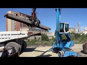 Terex MHL350 Fuchs Material Handler Loading Scrap on Cat 777C Dumper - Sotiriadis/Labrianidis