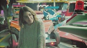 Woman posing in mechanical rides - Free Stock Video